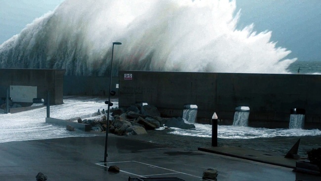 Beach Wave Crashing Against Seawall